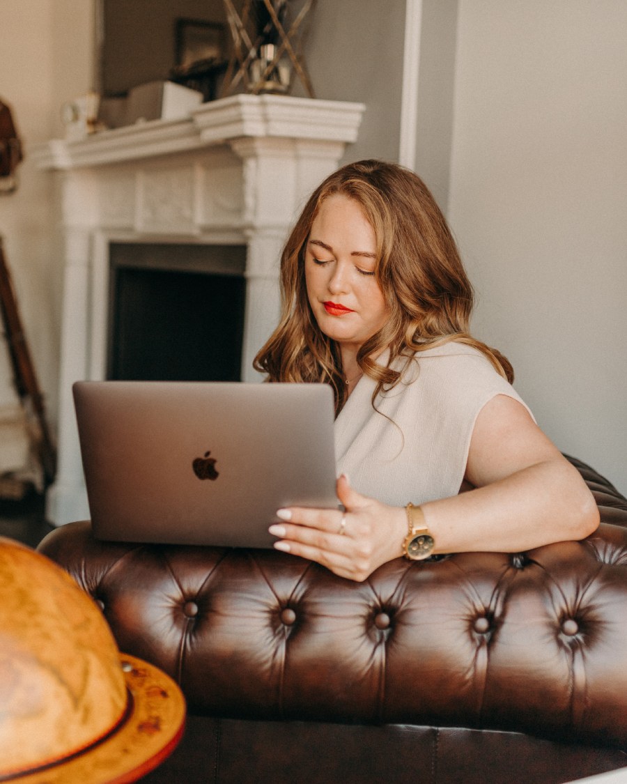 Digital Marketing Consultant & SEO Specialist Aoibhinn Cullen from The OG Marketing Agency works on her laptop creating a content marketing strategy