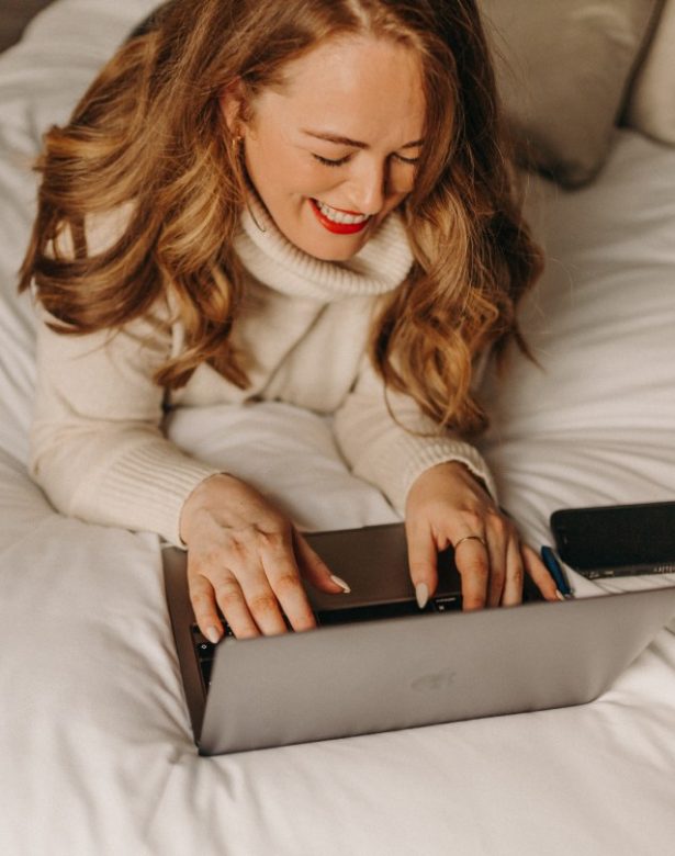 Digital Marketing Consultant & SEO Specialist Aoibhinn Cullen from The OG Marketing Agency works on her laptop creating a content marketing strategy